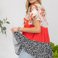 Celeste Full Size Printed Color Block Ruffled Short Sleeve Top